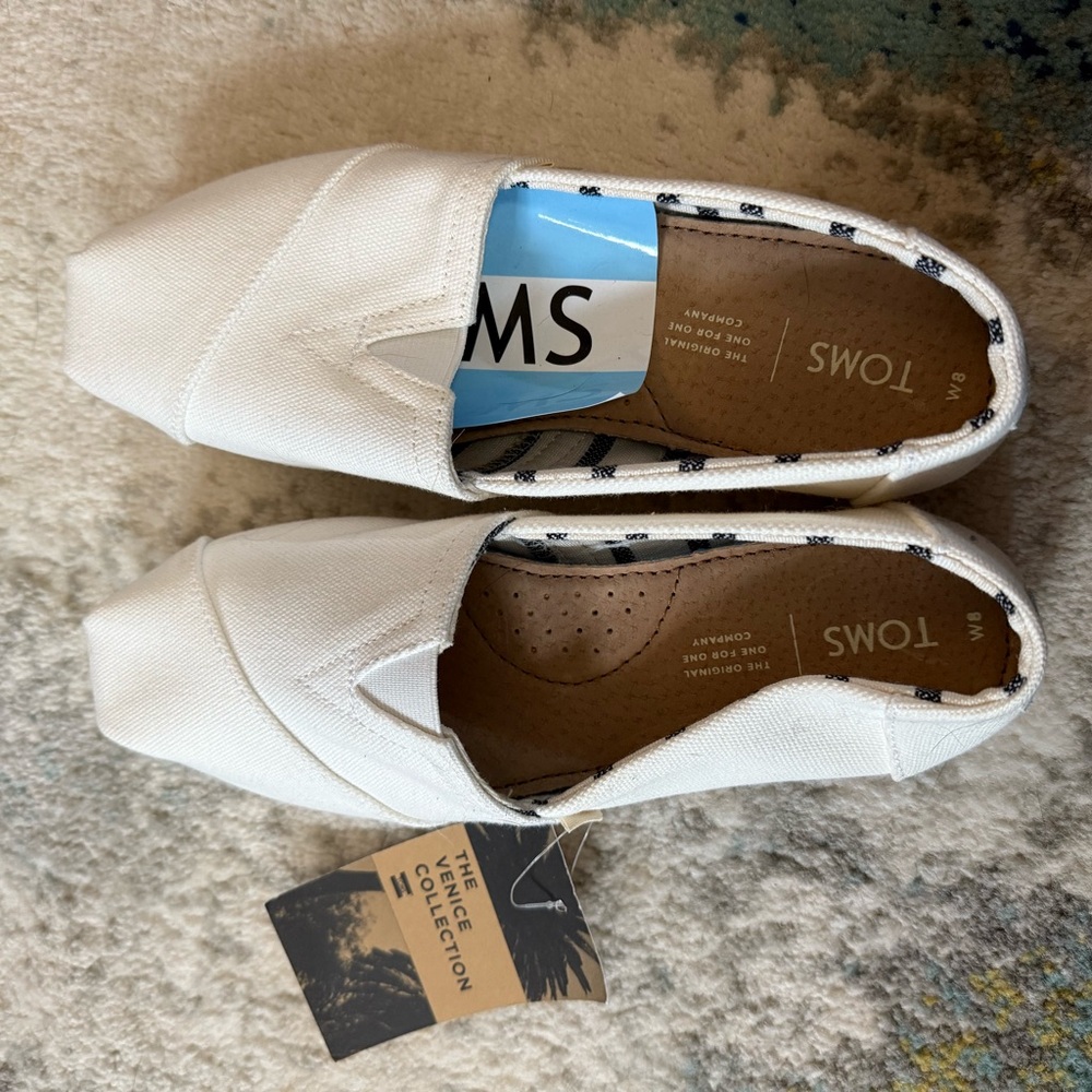 TOMS Cream and Black Striped Slip-Ons